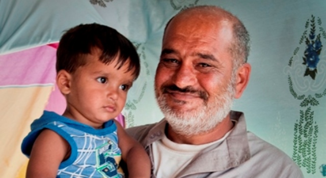 Padre e bambino siriani