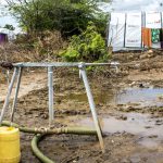 Woman_fills_jerrycan_at_waterpoint_installed_at_Bandi_Camp_0